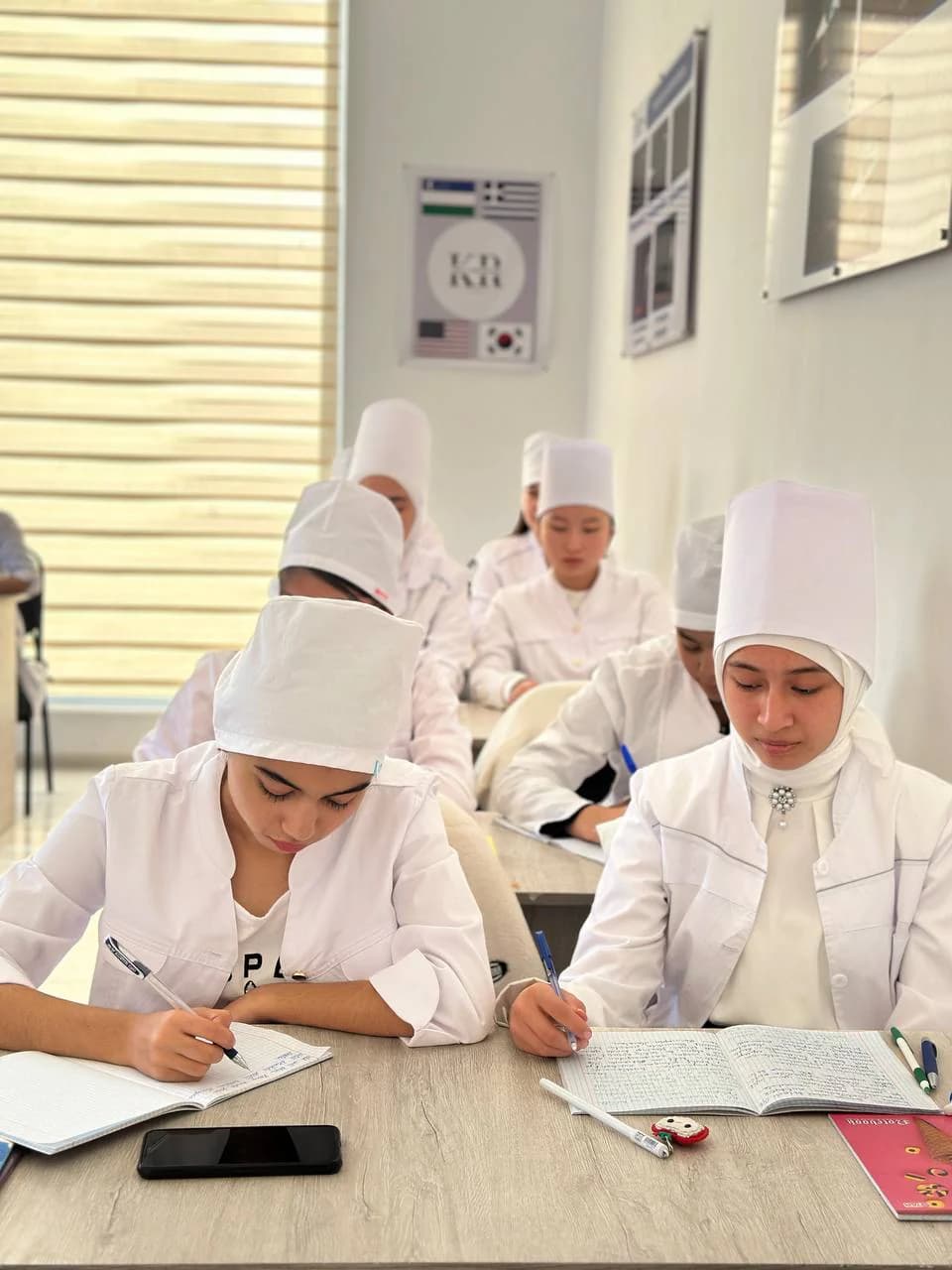 Students taking notes in class